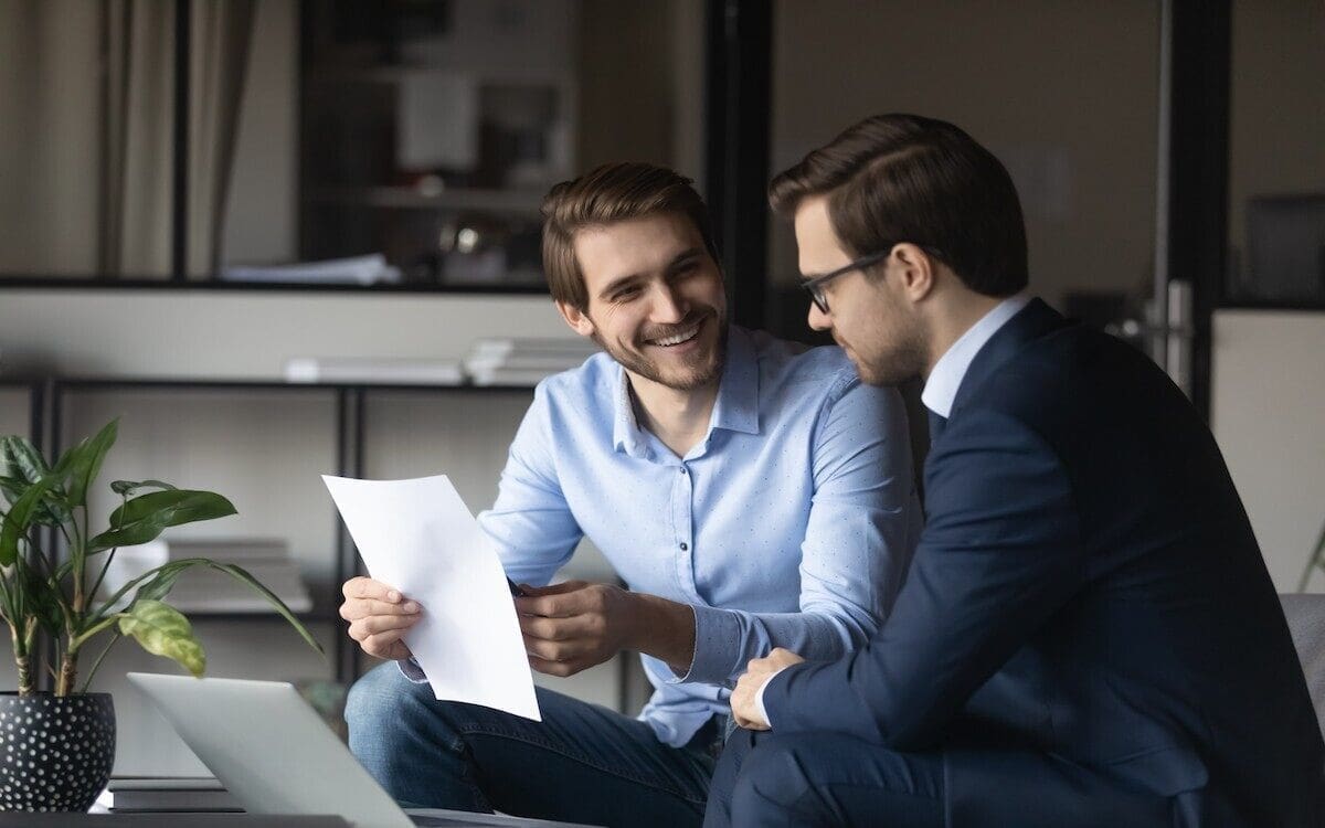 two investors discussing an income statement