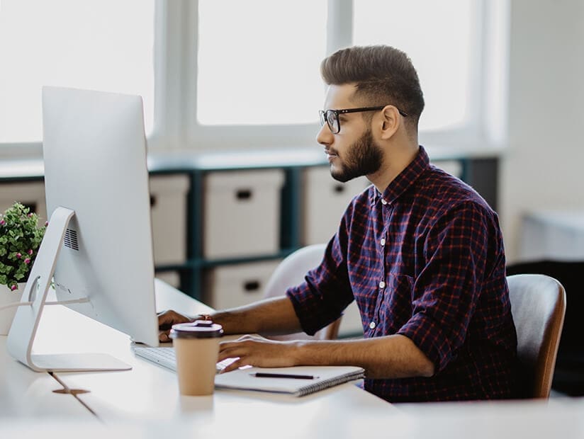 What Does an Accountant Do and Does My Business Need One? 3 accountant working at desktop computer