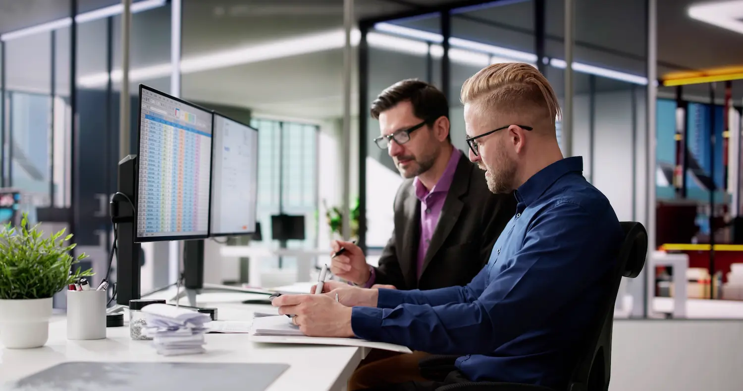 How to Plan and Make Decisions Like Recession-Proof Businesses 1 Two people working in office to recession-proof their business
