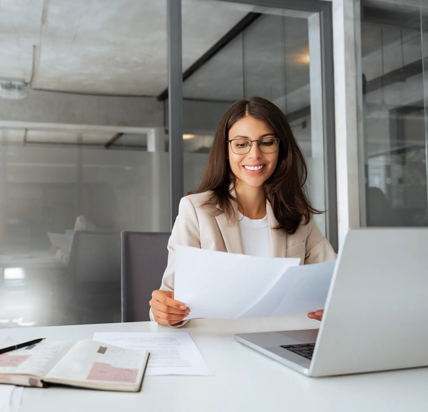 Talent Solutions for CPA Firms | Paro 6 smiling latin business woman saleswoman working on laptop computer 2605610795 1