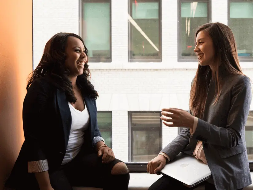 Talent Solutions for CPA Firms | Paro 30 two women sitting windowsill 1