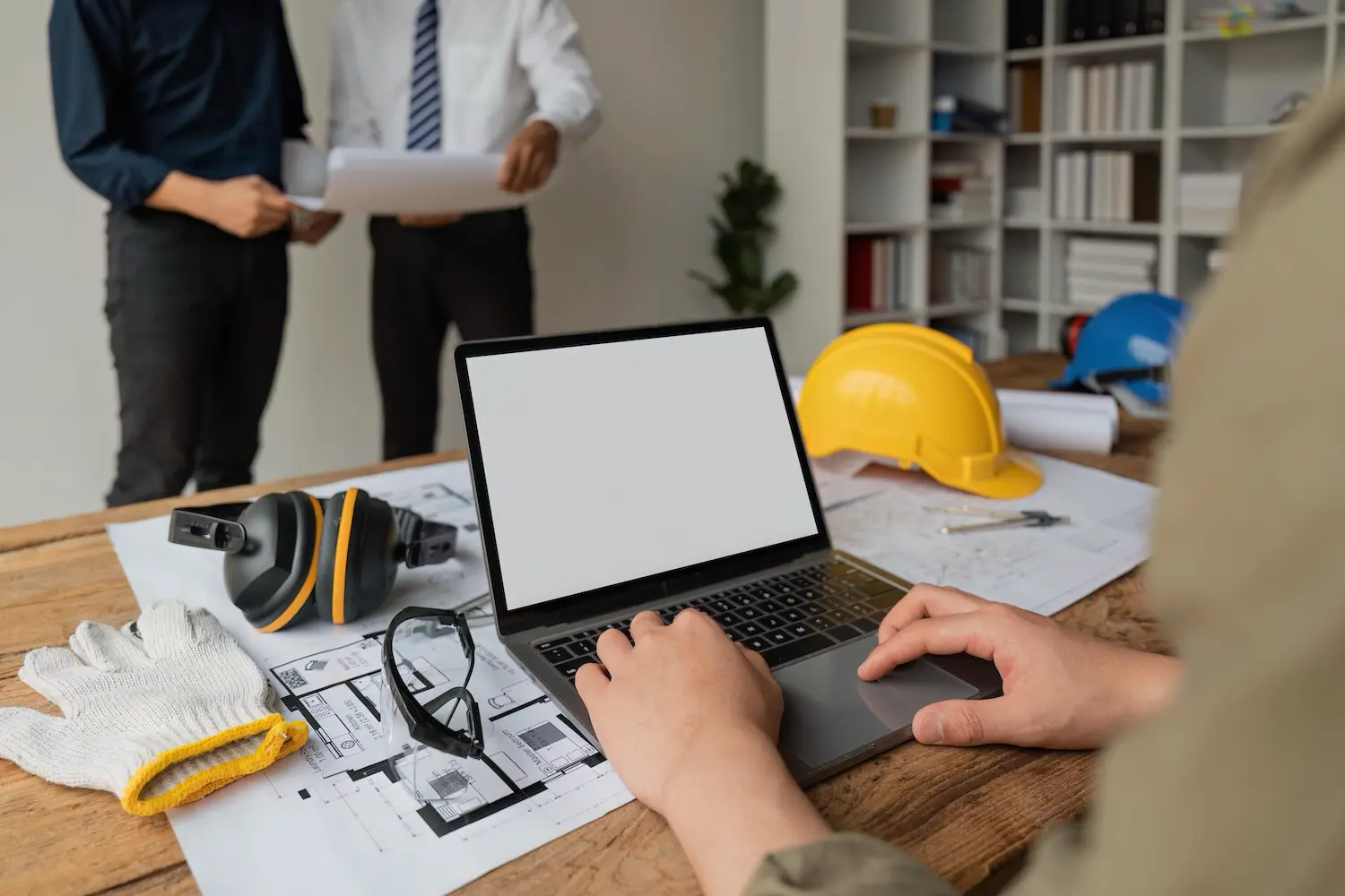 What Is Retainage in Construction? Why It Matters and How to Manage It 2 An accountant reviews his retainage schedule for a construction project.