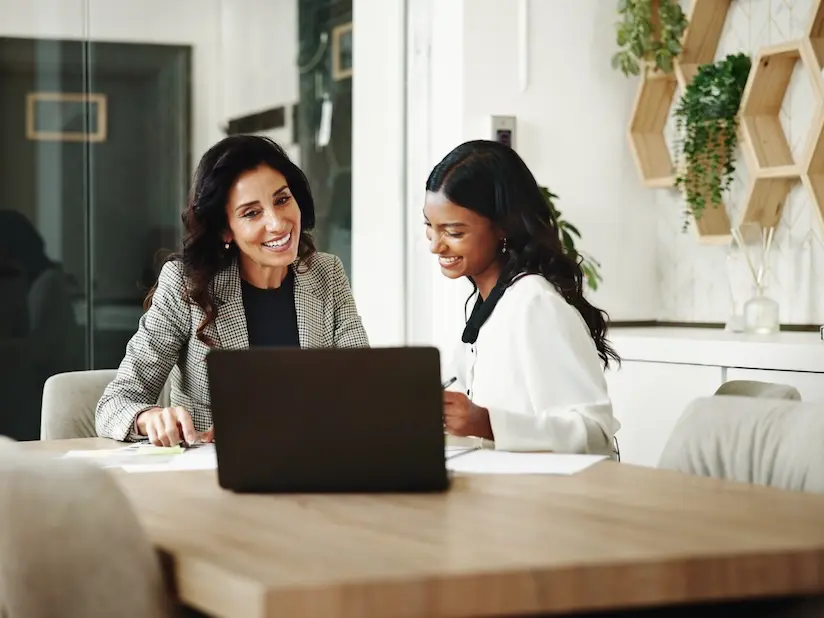 An accountant reviews financial statements with a SaaS leader