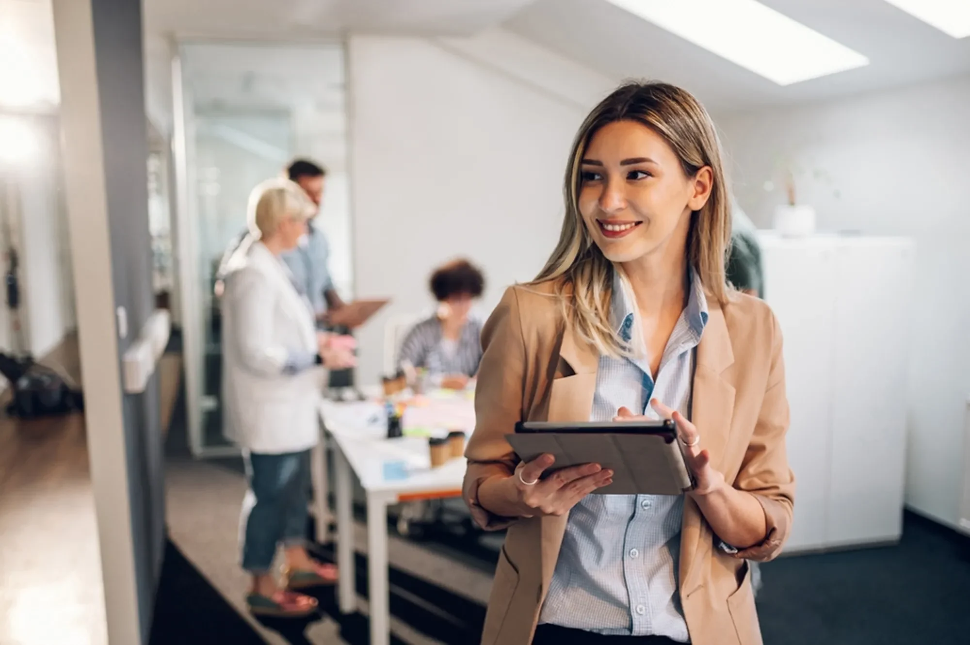 woman leading team in office 2155412093 1 e1764074467421